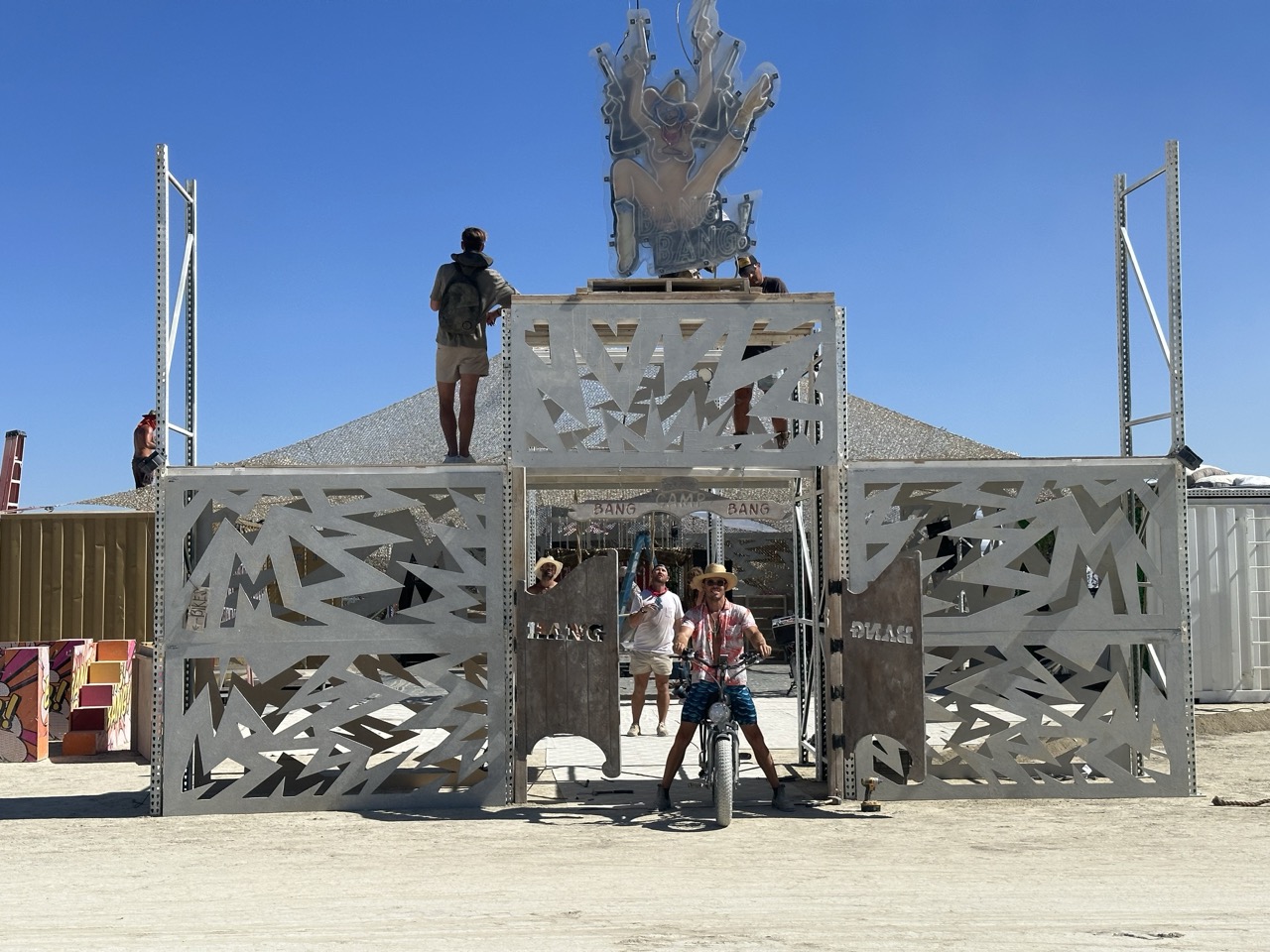 Daytime view of the Camp Bang Bang front gate structure on playa.
